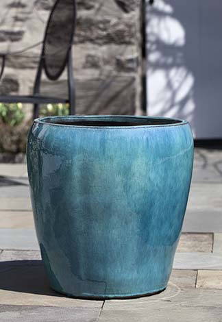 Blue container shown on grey patio