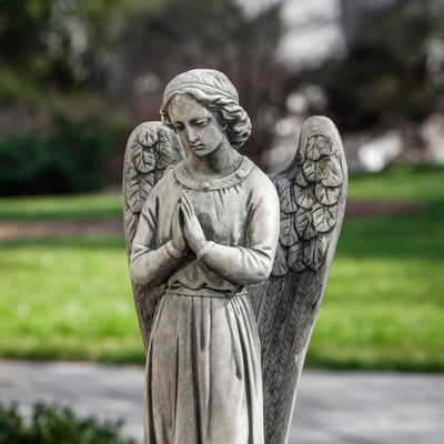 Close up of praying angel with wings