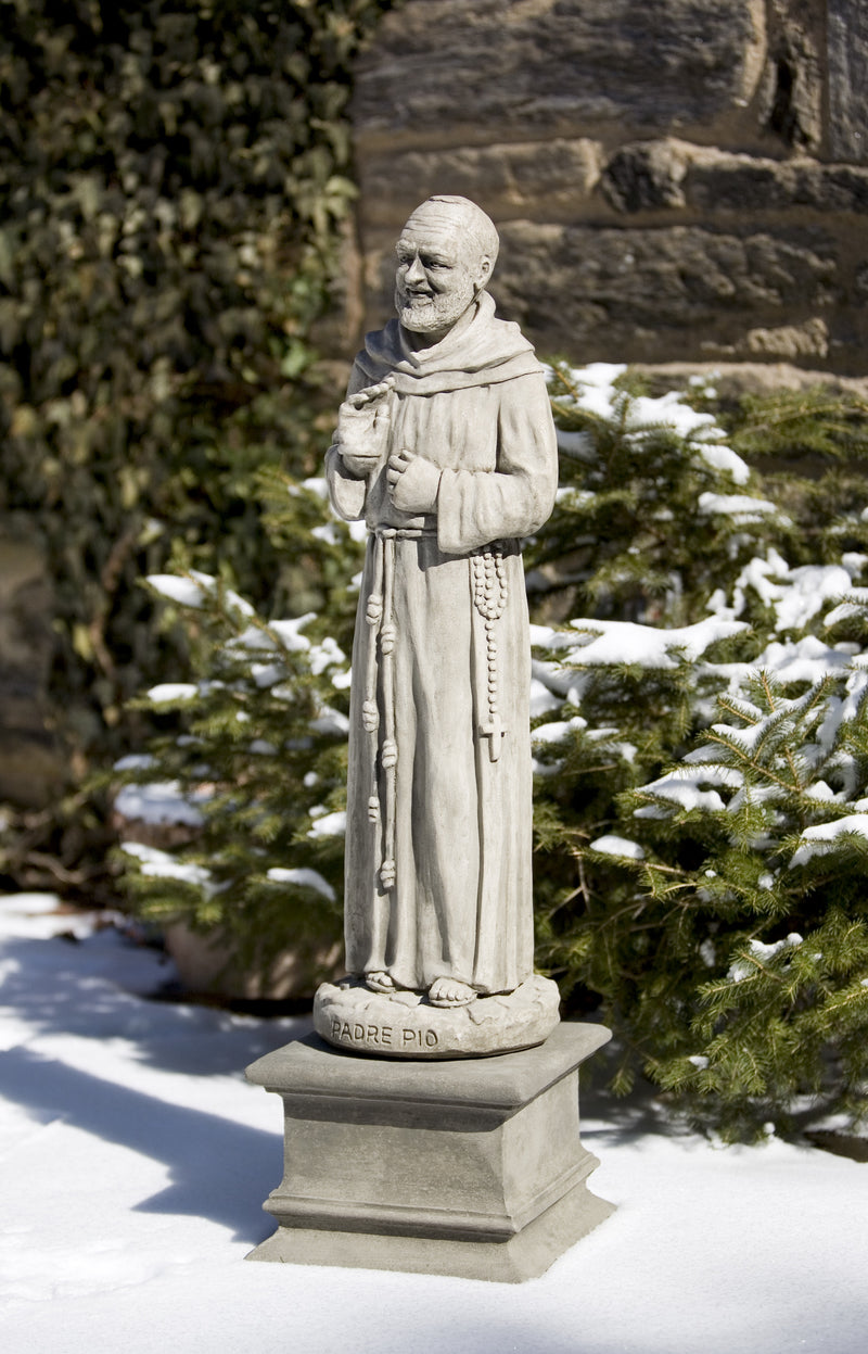 Padro Pio standing on small square pedestal