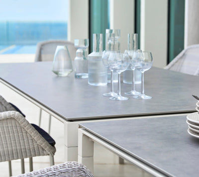Glassware on top of grey table on outdoor patio