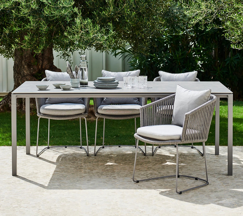 Dining set with tableware  on top under a tree