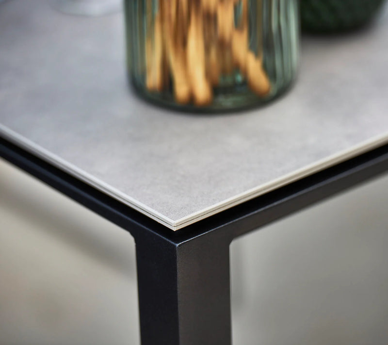Close up of corner of a grey table