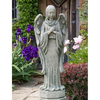 Standing praying angel on top of small plinth