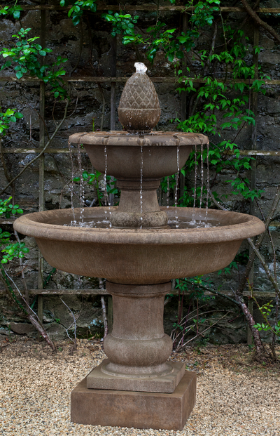 Brown tiered fountain with two round bowls on top of pedestal