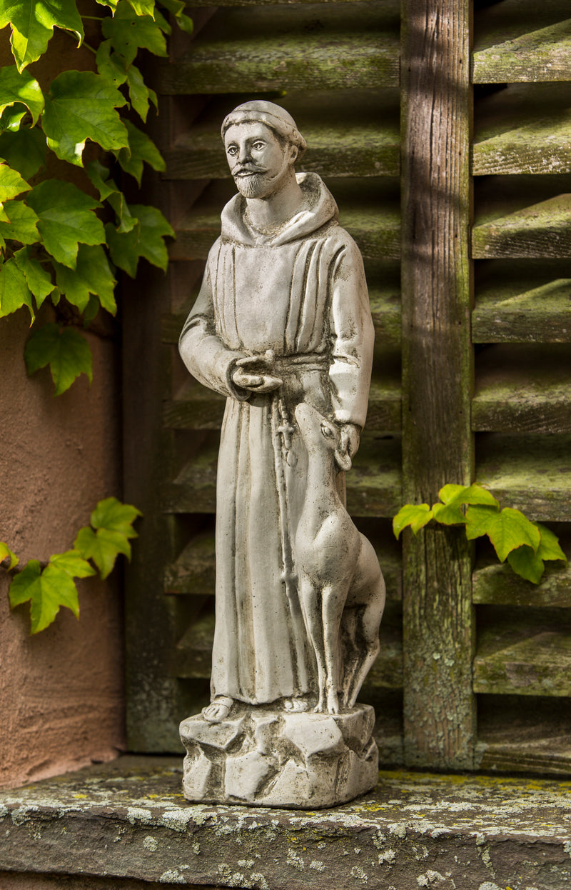 St Francis with animals  displayed on stone wall