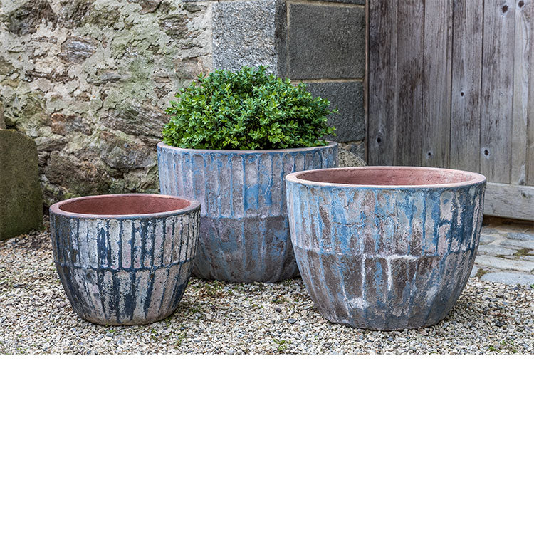 Grouping of 3 containers on gravel