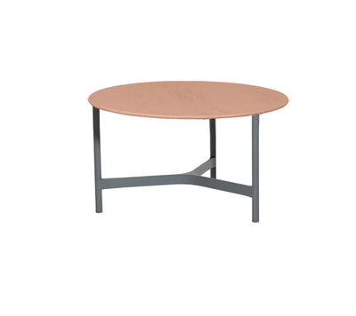 Light brown round coffee table on white background