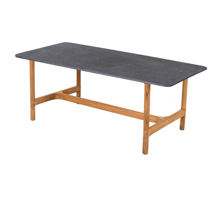 Black top rectangular table with wooden legs on white background