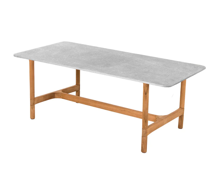 Light gray rectangular coffee table with wooden legs on white background