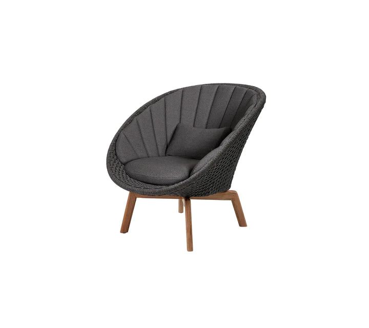 Black armchair with  matching cushions on white background