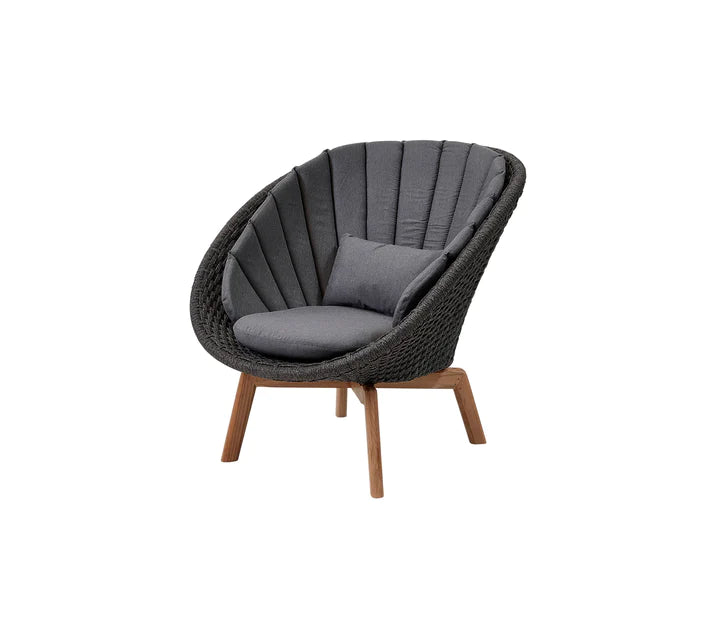 Black armchair with black cushions on  white background