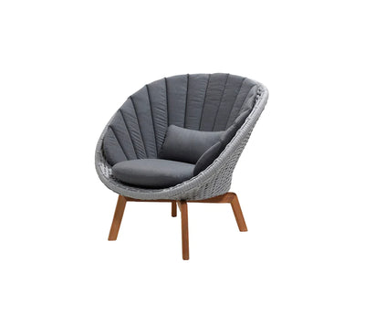 Gray armchair with dark gray cushions on white background