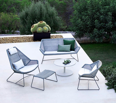 Contemporary black woven sitting grouping on a terrace