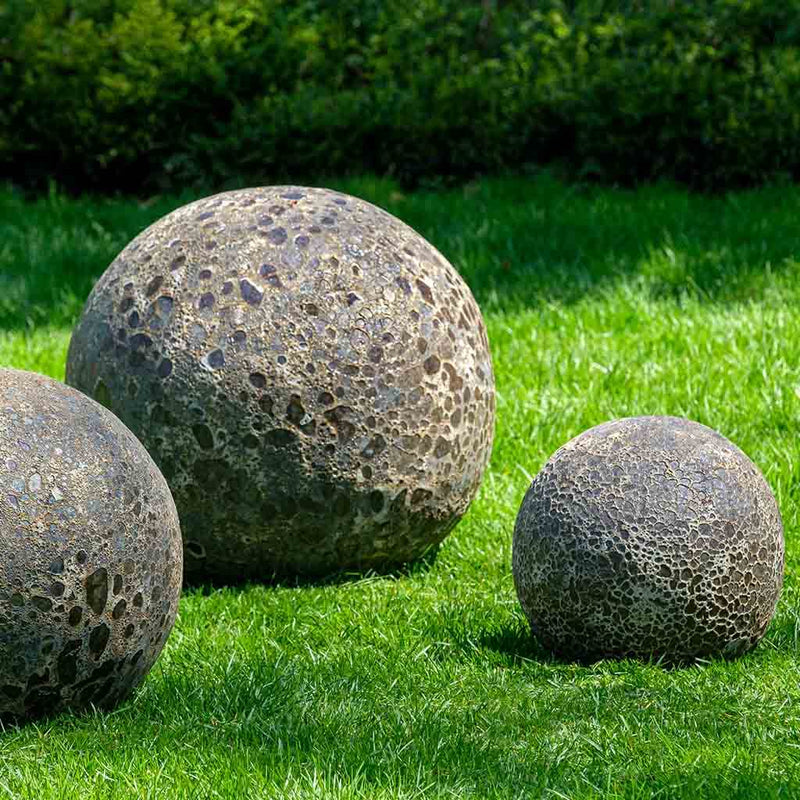 Large, medium and small Angkor spheres on grass