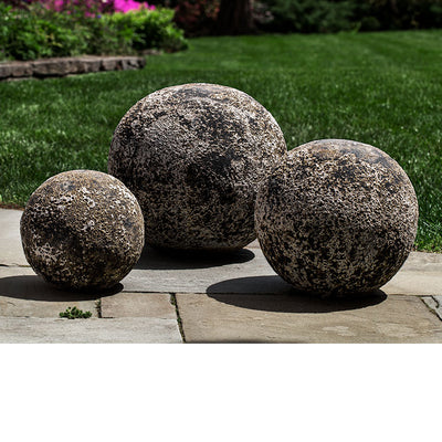 Large, medium and small Angkor spheres on stone floor