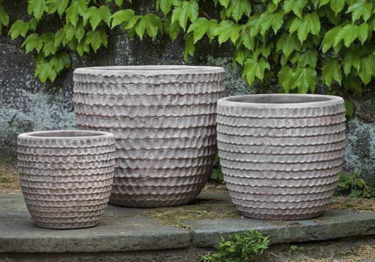 Grouping of 3 grey containers shown in front of ivy