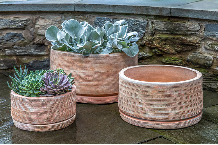 Grouping of 3 terra cotta bowls with saucers