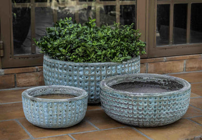 Grouping of 3 low bowls in front of patio door