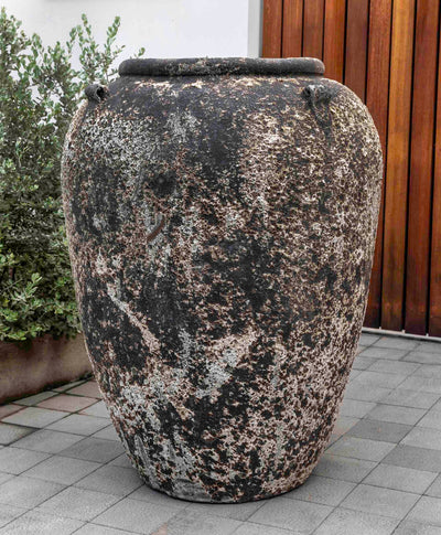 Large rustic jar in front of door