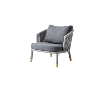 Gray armchair with matching cushions shown on white background