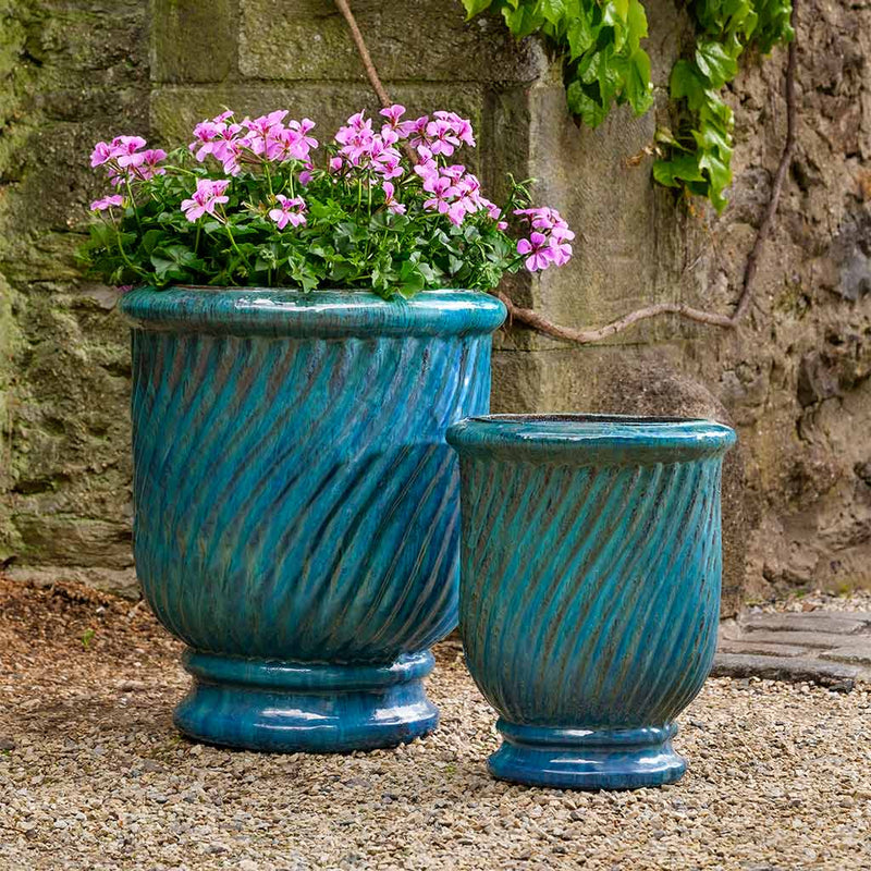 Set of 2 blue containers shown on gravel