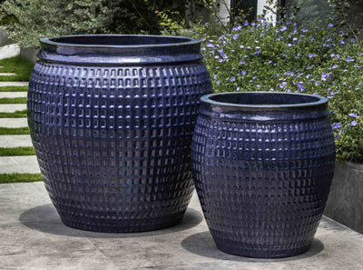 Set of 2 containers shown in front of blue flowers