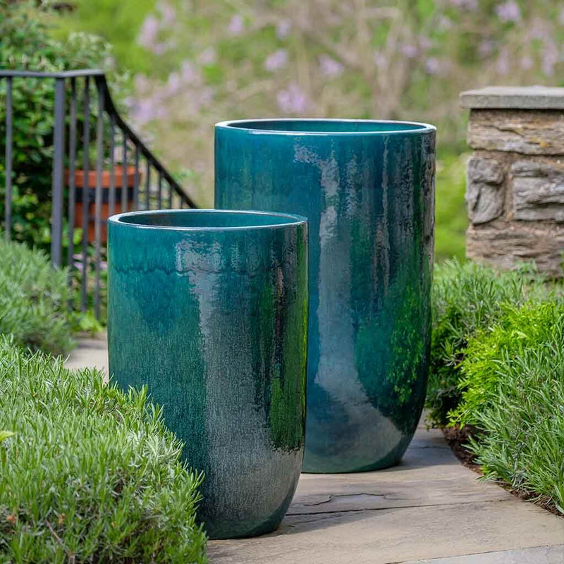 Set of 2 blue containers shown on walkwat
