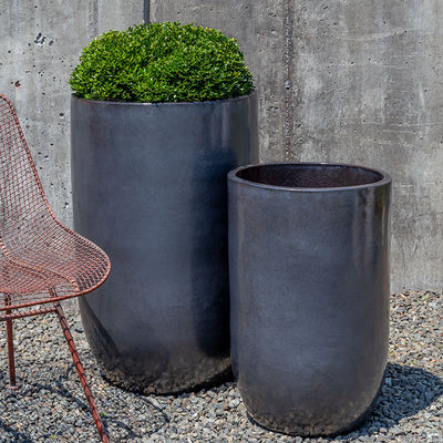 Set of 2 grey containers shown in front of concrete wall