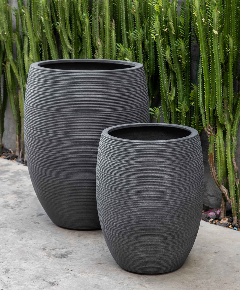Set of 2 grey containers in front of succulents