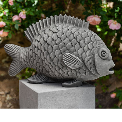Gray fish on top of square pedestal