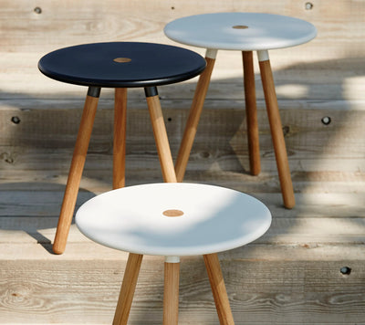 Three round coffee tables shown on wooden terrace