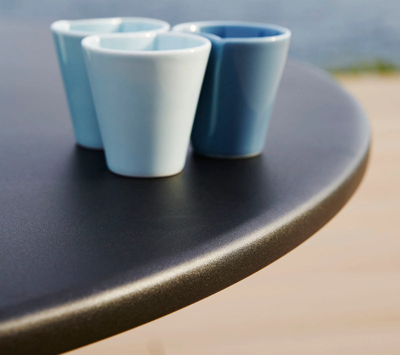 Close up of table top with three cups