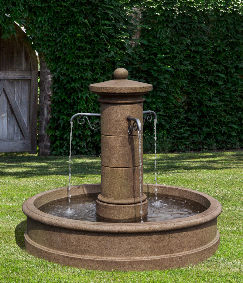 Classic French fountain style with three metal spouts pouring into a round basin