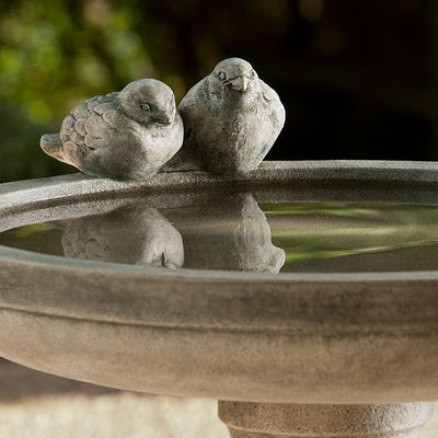 Detail of the two birds on the side of birdbath