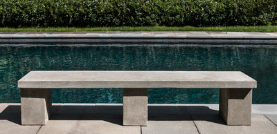 Straight bench top on three legs, pictured in front of a pool