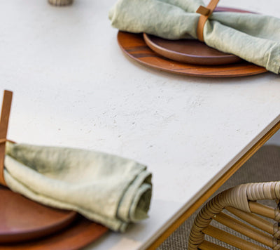 Close up of gray table top with plates and napkins