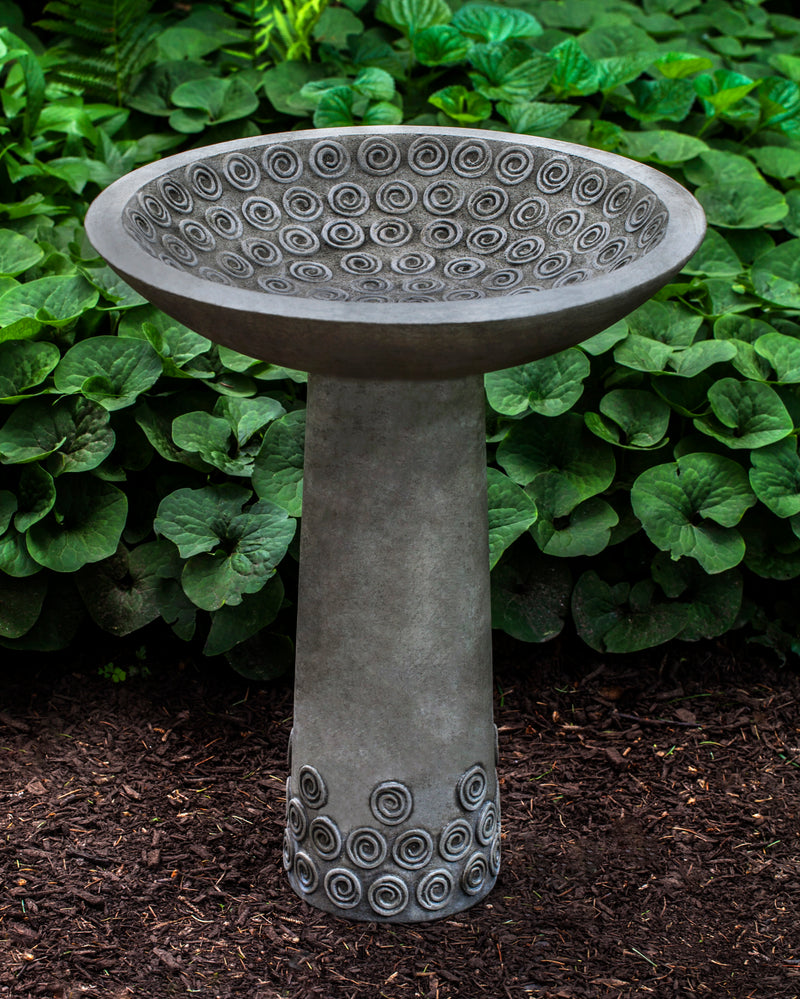 Birdbath with spiral designs in bowl  and bottom of stand