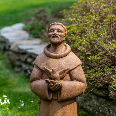 Close up of Saint Francis holding a bird