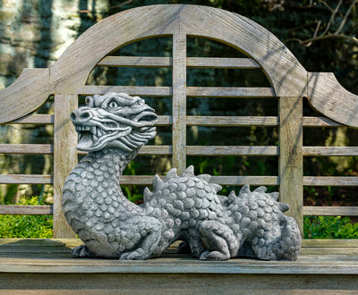 Light gray dragon on wooden bench