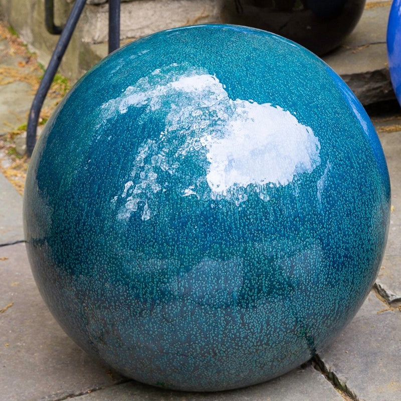 Blue glazed ceramic sphere close up