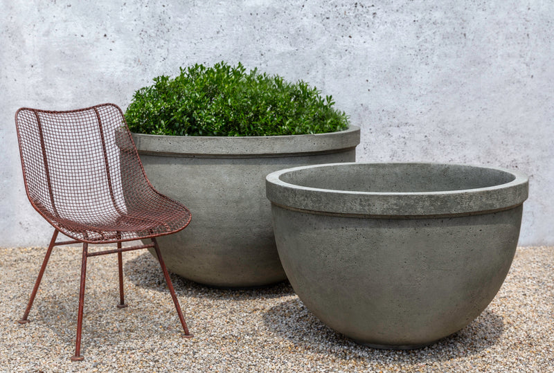 Two large bowls shown next to a metal chair
