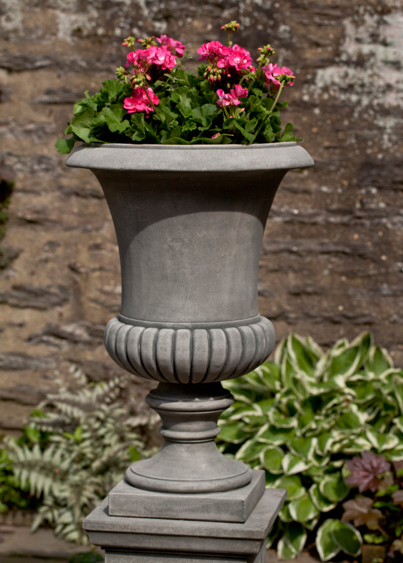 Classic grey urn planted with geraniums