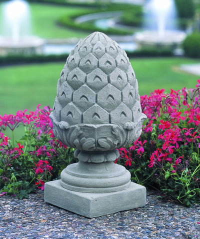 Pineapple shaped finial on top of short square plinth