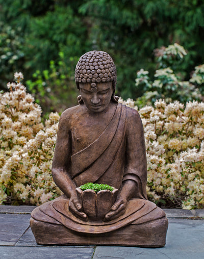 Sitting buddha holding vessel planted with greenery