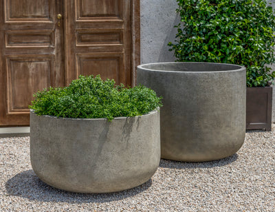Set of 2 large containers shown in front of a door