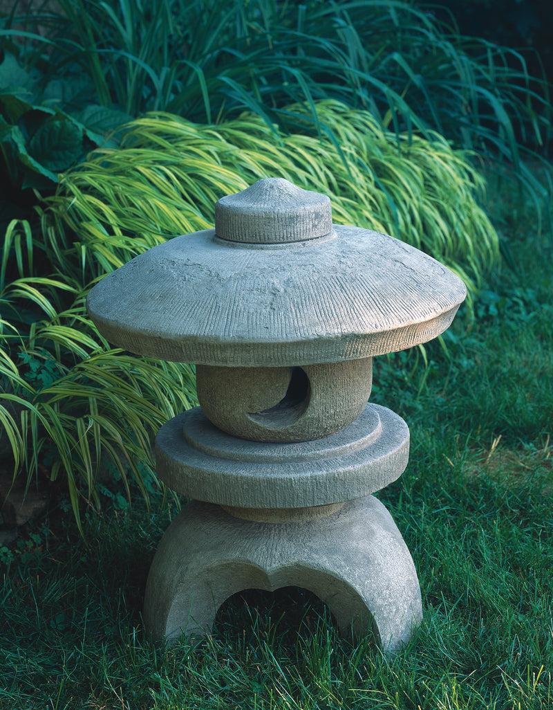 Small rounded Asia-inspired pagoda in front of grasses