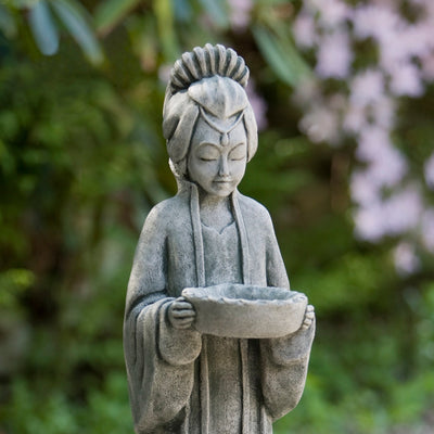 Close up of Asia-inspired maiden holding a bowl