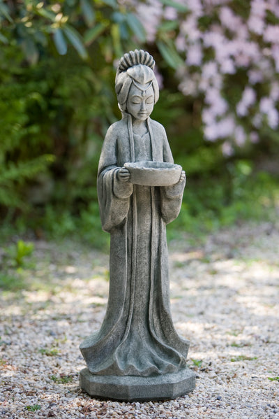 Standing Asia-inspired maiden holding a bowl