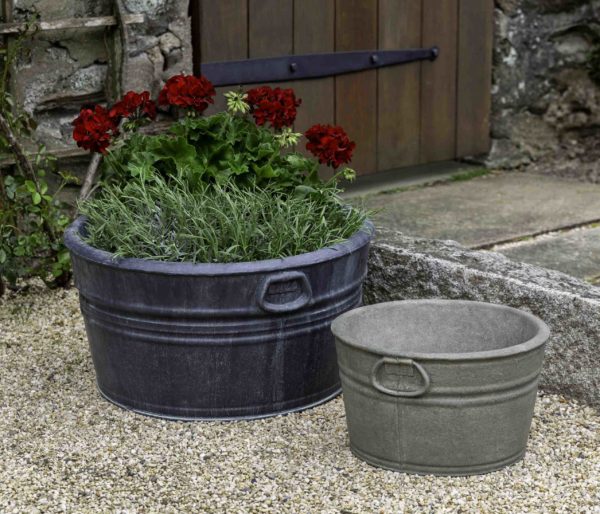 Set of 2 farm tub containers  shown in front of wooden door and sitting on gravel
