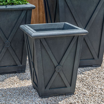 Grouping of 3 slate grey containers shown on gravel floor